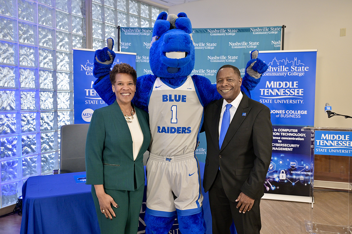 Middle Tennessee State University President Sidney A. McPhee, right, and Nashville State Community President Shanna L. Jackson, left, take a congratulatory photo with MTSU mascot Lightning following a signing ceremony between the institutions held Tuesday, Jan. 28, at Miller Education Center on MTSU’s campus in Murfreesboro, Tenn. The leaders of the two institutions signed agreements opening seamless pathways for Nashville State graduates earning an associate degree to transfer to MTSU to pursue bachelor’s degrees in either aerospace or cybersecurity management. (MTSU photo by Andy Heidt)