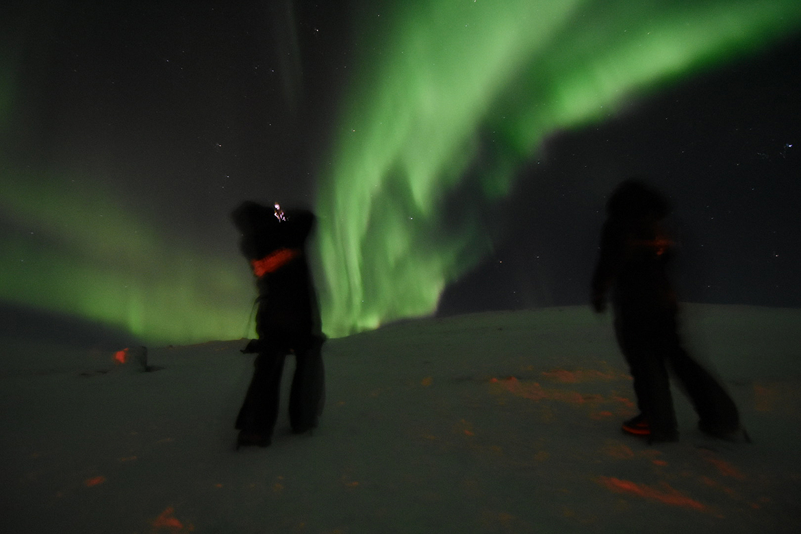 In bitter cold temperatures atop a mountain at the Arctic Circle in Sweden, people observe and photograph the aurora borealis or northern lights. A recent trip to view the aurora by Middle Tennessee State University Physics and Astronomy professor John Wallin will be the subject of his Star Party talk starting at 6:30 p.m. Friday, Feb. 7, in Wiser-Patten Science Hall Room 102. (MTSU photo by John Wallin)