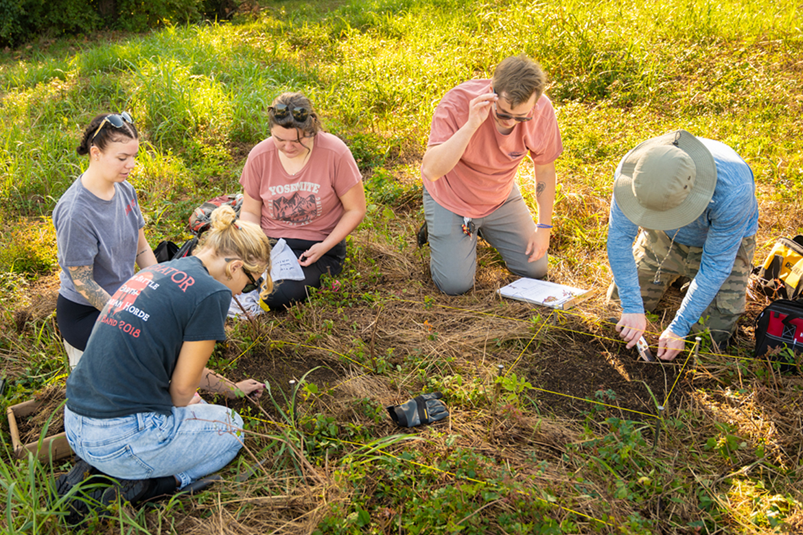 Introduction to Archaeology students at Middle Tennessee State University in Murfreesboro, Tenn., are joined by volunteers to dig for artifacts on the Bass Street Community Archaeology Project at Fort Negley Park in Nashville, Tenn., in October 2024. Working together are, from left, Lexi Guza, Rhiannon Nourse, volunteer Madeline Laderoute, Jackson Edwards and Michael Sutherland. (MTSU photo by James Cessna)