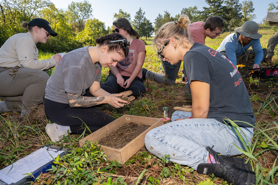 Students in the Introduction to Archaeology at Middle Tennessee State University in Murfreesboro, Tenn., are getting hands-on with history through ongoing research each semester with the Bass Street Community Archaeology Project at Fort Negley Park in Nashville, Tenn. Digging together at the site in October 2024 are, front from left, Rhiannon Nourse and Lexi Guza, and back, from left, community volunteers Katharine Bogen and Madeline Laderoute, and students Jackson Edwards and Michael Sutherland. (MTSU photo by James Cessna)