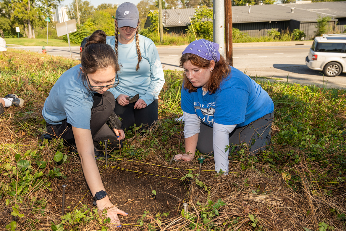 Students in the Introduction to Archaeology at Middle Tennessee State University in Murfreesboro, Tenn., are getting hands-on with history through ongoing research each semester with the Bass Street Community Archaeology Project at Fort Negley Park in Nashville, Tenn. Digging together at the site in October 2024 are, from left, Taylor Tims, Alanah Shadowens and Elauna Hicks. (MTSU photo by James Cessna)