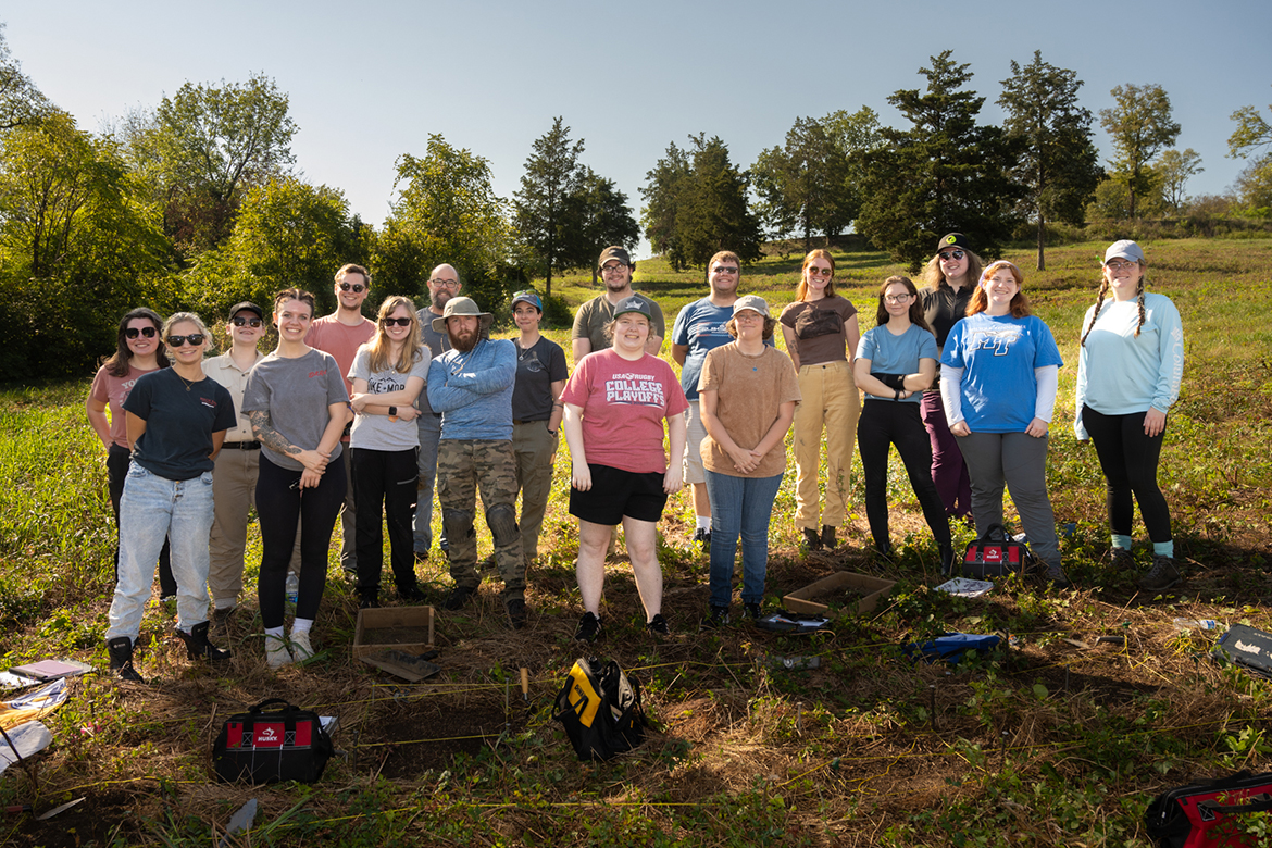 Students in the Introduction to Archaeology class at Middle Tennessee State University in Murfreesboro, Tenn., are getting hands-on with history through ongoing research at the site of one of the first post-Civil War Black neighborhoods in Nashville, Tenn., located at Fort Negley Park. Students who participated in a dig in October 2024 at the historic site are, from left, volunteer Madeline Ladourete, Lexi Guza, volunteer Katharine Bogen, Rhiannon Nourse, volunteer Jackson Edwards, Madelyn Dawson, Intro to Archaeology professor Andrew Wyatt, Michael Sutherland, volunteer Clelie Cottle Peacock, Selah Burton, Joshua Lingle, Bridgette Witherow, Daniel Corbin, Annalevi Chavis, Taylor Tims, Vanderbilt University archivist Angela Sutton, Elauna Hicks and Alanah Shadowens. (MTSU photo by James Cessna)