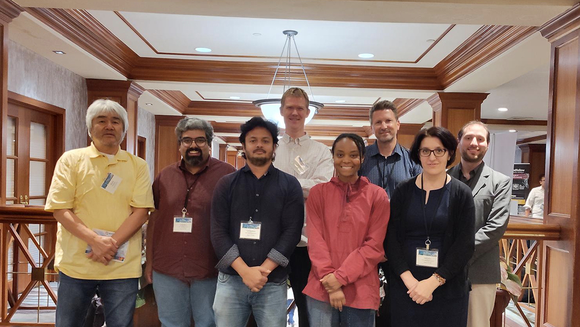 From left, Fisk University research associate professor Akira Ueda, Middle Tennessee State University postdoctoral researchers Anirudha Mirmira and Wasin Mondal, Oak Ridge National Laboratory senior research scientist Tom Berlijn, Fisk student researcher India Gooch, ORNL distinguished researcher Thomas Maier and MTSU physics faculty members Hanna Terletska and John Villanova participate in an ORNL-organized scientific meeting Aug. 12-13 at the Crowne Plaza Hotel in Knoxville, Tenn. Tennessee Quantum Materials Workforce Development and Training program, or TN-QuMat, students, postdoctoral researchers and principal investigators from MTSU, Tennessee State University, Fisk University and ORNL were among session attendees. (Submitted photo)