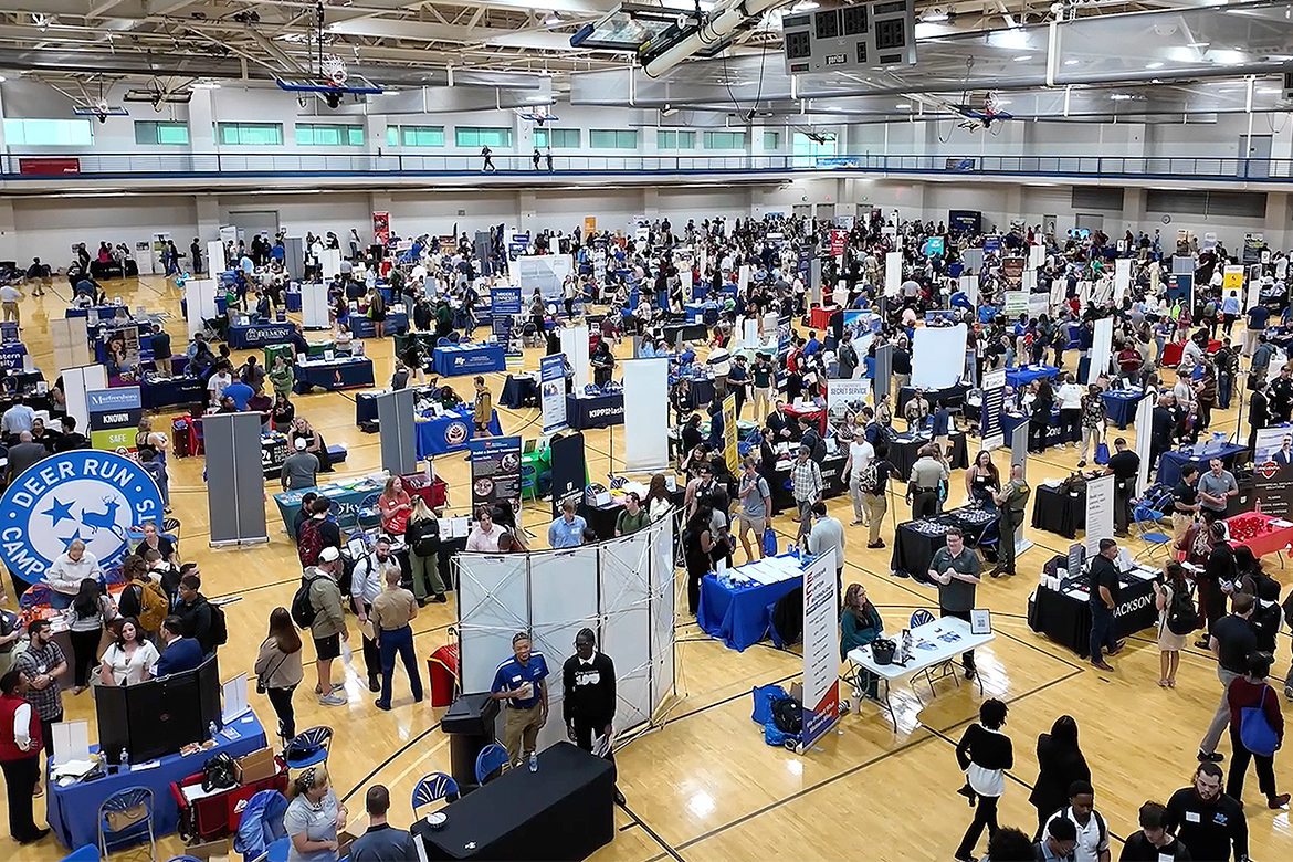 The Campus Recreation Center gymnasium at Middle Tennessee State University in Murfreesboro, Tenn., was packed with potential on Thursday, Sept. 25, for the annual Big Career Fair hosted by the Career Development Center. A record-breaking 2,082 students and alumni perused booths manned by 220 employers. (MTSU photo by Karli Sutton)