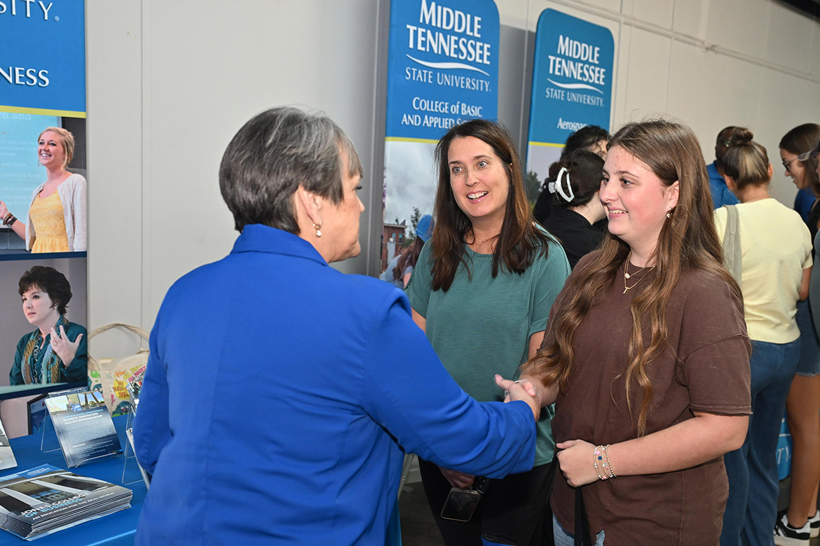 Jones College of Business Dean Joyce Heames, left, talks with a student and parent at the 2025 Middle Tennessee State University True Blue Tour kickoff reception held Tuesday night, Sept. 16, at the Blue Ribbon Circle Club in Shelbyville, Tenn. (MTSU photo by James Cessna)