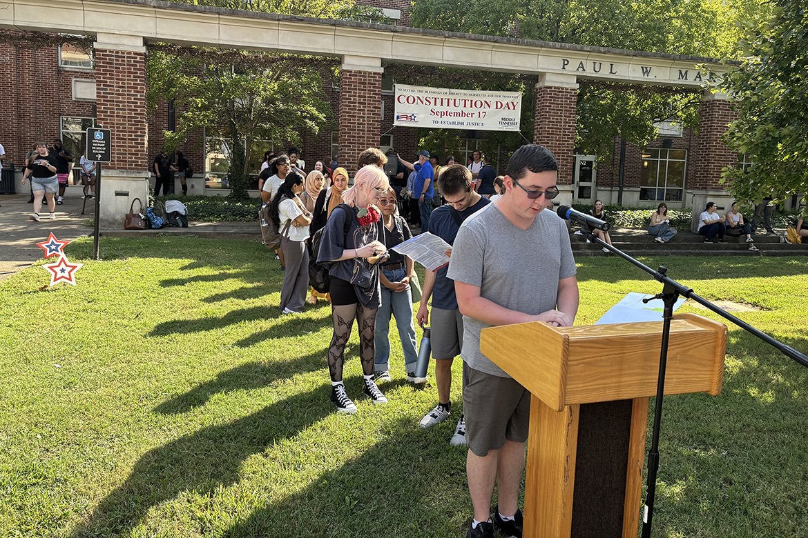 Fall 2025 Middle Tennessee State University Honors College Buchanan Lecture Series participants wait their turn as senior biology major Phillip Dauer, of Spring Hill, Tenn., reads part of the U.S. Constitution outside the Paul W. Martin Sr. Honors Building in Murfreesboro, Tenn., on Monday, Sept. 15. The fall series theme is “Spaces and Places” and continues until Nov. 17. (MTSU photo by Randy Weiler)