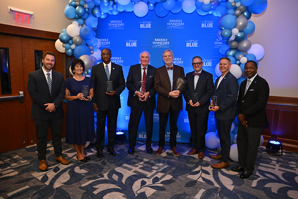 Shown with Middle Tennessee State University Alumni Board President Patrick Morrison (Class of 2012), far left. of Nashville, Tenn., and MTSU President Sidney A McPhee, far right, are 2025-26 Distinguished Alumni and True Blue Citations of Distinction honorees, from left, Deidra Goins, of Manchester, Tenn., William “Bill” Roper of Stafford, Va., Hal Hardin and Keel Hunt, of Nashville, Tenn., Scott Cook, of Dyersburg, Tenn., and Chaney Mosley, of Nashville on Friday, Sept. 19, in the Sam Ingram Building on campus in Murfreesboro, Tenn. Young Alumni recipient Julien Baker of Memphis, Tenn., was unable to attend. (MTSU photo by James Cessna)