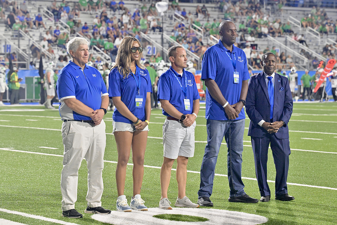 From left, Middle Tennessee State University Athletic Director Chris Massaro, 2025 Blue Raider Hall of Fame members Ann Dudley (track), Garth Petrilli (football) and Warren “Big Kat” Kidd (men's basketball)and MTSU President Sidney A. McPhee receive acknowledgement from the crowd attending the MTSU Homecoming Game in Floyd Stadium in Murfreesboro, Tenn., on Saturday, Sept. 20. Unable to attend were Ashley E. Adams (volleyball), Kevin Byard (football) and Jerry Singleton (track).(MTSU photo by J. Intintoli)