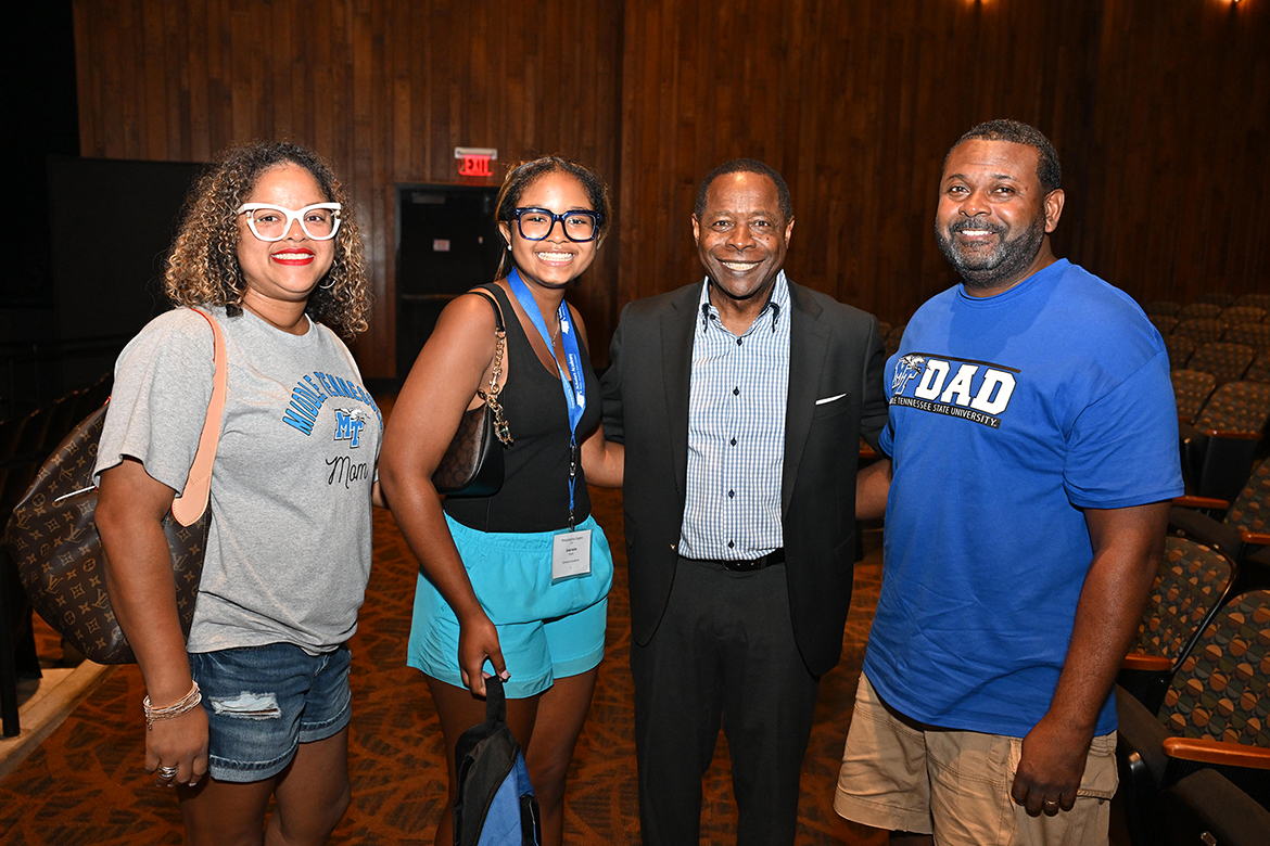 Middle Tennessee State University President Sidney A. McPhee, second from right, visits with freshman human resources management major Gabrielle “Gabby” Profit, second from left, of Arlington, Tenn., and her parents, mom Kristie Profit, left, and dad, Horace Profit, during the welcome event for Scholars Academy participants on Aug. 10 in Tucker Theater on campus in Murfreesboro, Tenn. Scholars Academy helps the students to navigate and prepare them for the start of the fall semester. (MTSU photo by James Cessna)