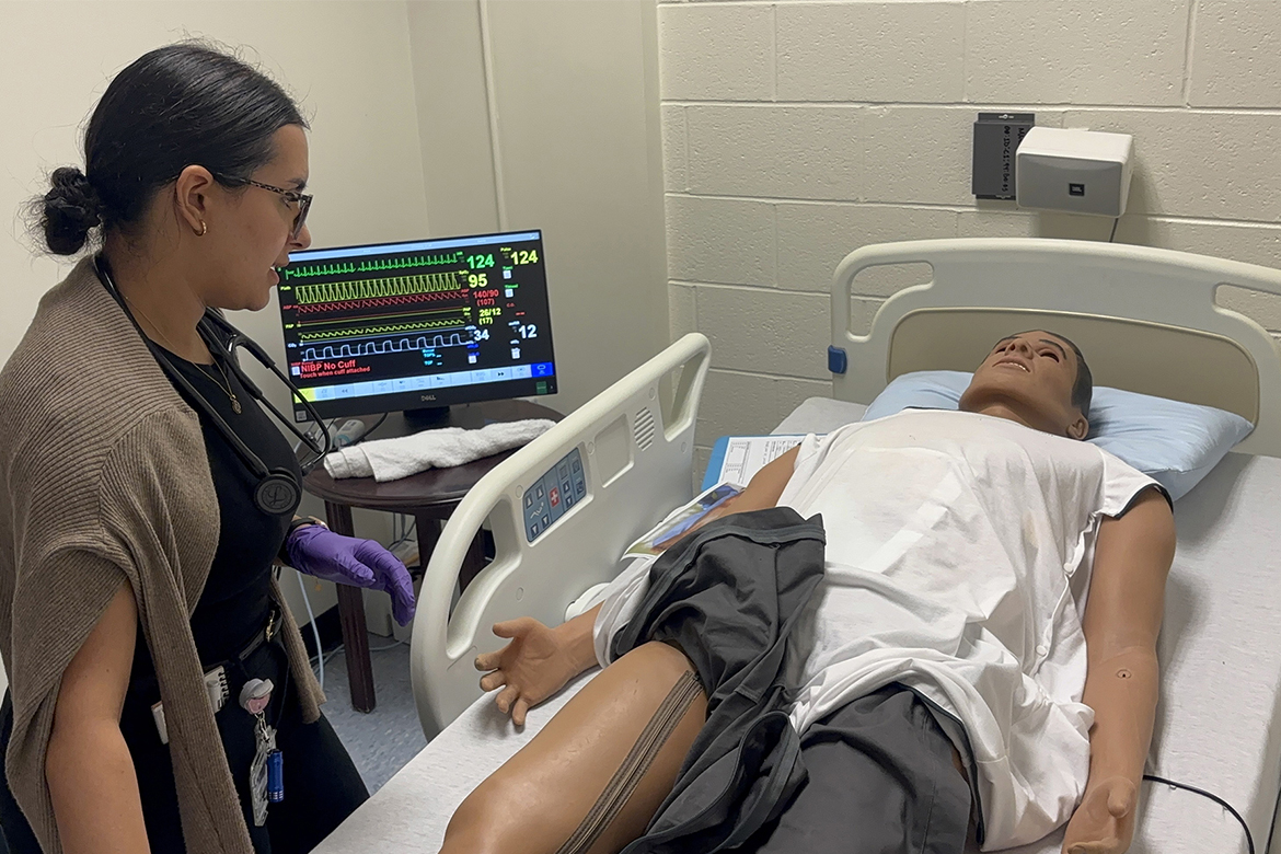 Duvene Hassan, a first-year Physician Assistant Studies student at Middle Tennessee State University in Murfreesboro, Tenn., examines a “patient” during a mock mass casualty simulation in July. The high-fidelity patient mannequin simulates a real-world situation to give students hands-on training before starting a year of clinical rotations in the second year of the 27-month program. (MTSU photo by Nancy DeGennaro)