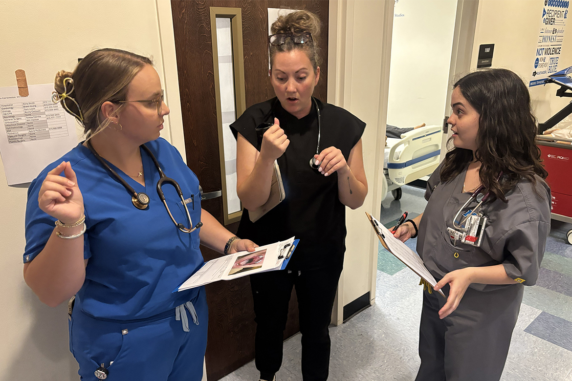 First-year Physician Assistant Studies students at Middle Tennessee State University in Murfreesboro, Tenn., from left, Hannah Riley, Anna Martinez and Samantha Freda, discuss a plan of action during a mock mass casualty simulation held in July on campus. The simulation is geared toward helping the students be prepared for real-world situations as they head into yearlong clinical rotations starting in the second year of the 27-month program. (MTSU photo by Nancy DeGennaro)