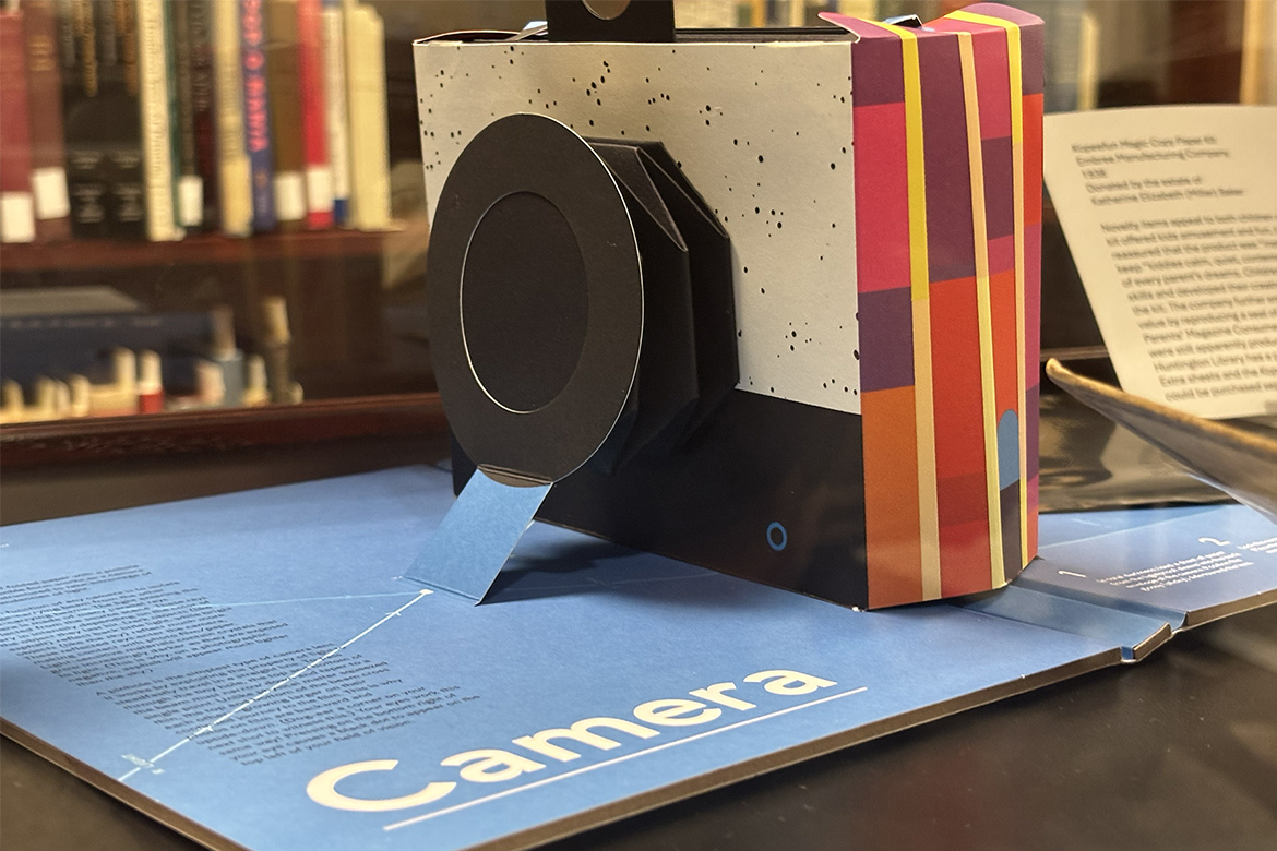 The “Playful Paper” exhibit at James E. Walker Library at Middle Tennessee State University in Murfreesboro, Tenn., highlights the fascinating world of paper-based toys, games and books like this pinhole camera that comes in pop-up book form. Other items include toy theater sets and vintage games — all printed and made of paper. (MTSU photo by Nancy DeGennaro)