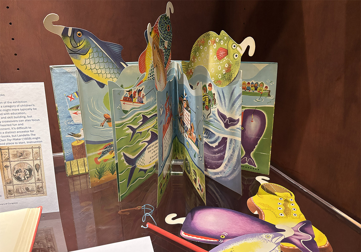 A colorful fishing game pop-up book invites readers to “catch” paper fish with a toy rod and hook. The game activity book is part of the “Playful Paper” exhibit on display until early December at James E. Walker Library at Middle Tennessee State University in Murfreesboro, Tenn. (MTSU photo by Nancy DeGennaro)