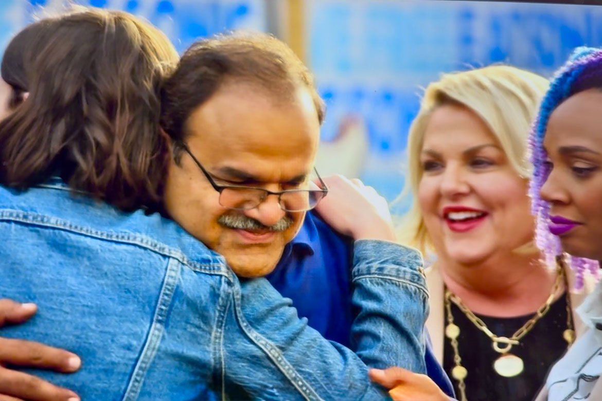 Middle Tennessee State University marketing professor Raj Srivastava, who teaches in the Jennings A. Jones College of Business, hugs one of his other castmates on NBC’s “On Brand with Jimmy Fallon” after being eliminated from the show on Oct. 10, 1025. (Photo courtesy of NBC)