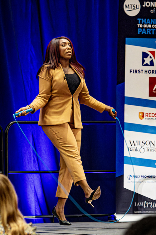 Inventor, CEO and entrepreneur Jessica O. Matthews demonstrates the jump rope she helped invent that has rechargeable batteries in the handles that can generate electricity when used during her keynote presentation about embracing artificial intelligence at Middle Tennessee State University’s 2025 Jones College of Business Leadership Summit held Sept. 26 at Embassy Suites in Murfreesboro, Tenn. (MTSU photo by Tom Beckwith)