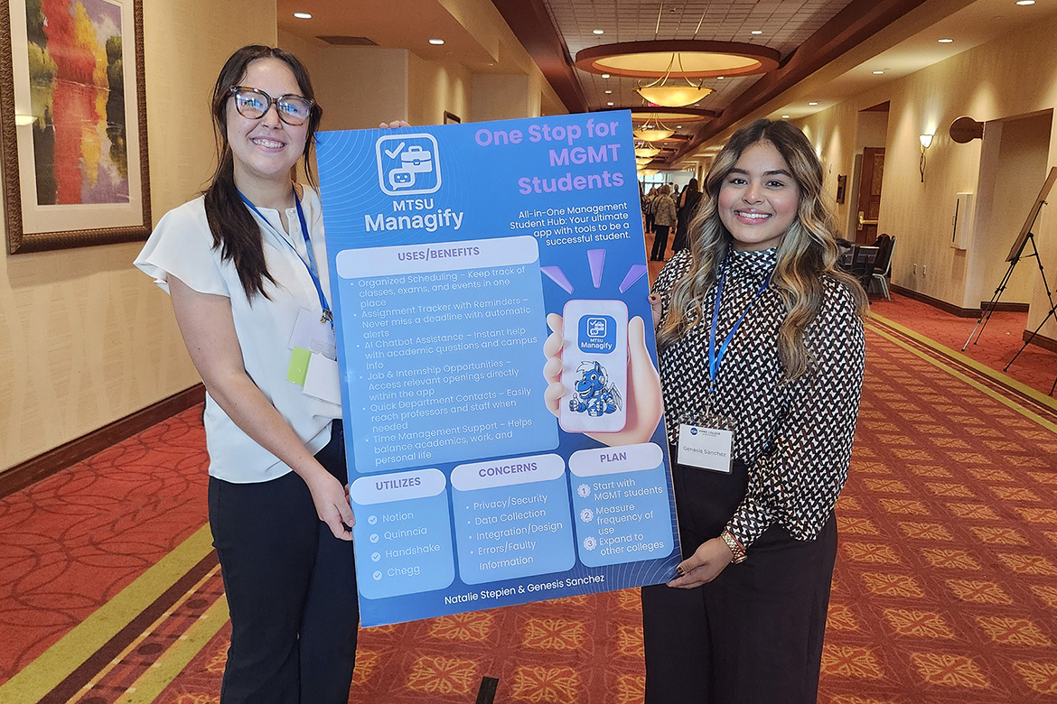 Middle Tennessee State University human resources major Natalie Stepien, left, and Genesis Sanchez, a management and leadership major, hold their winning poster presentation at MTSU’s 2025 Jones College of Business Leadership Summit on Sept. 26 at Embassy Suites in Murfreesboro, Tenn. Sanchez and Stepien were awarded Best Concept in the summit’s Innovative Leadership Challenge for the proposed app called MTSU Managify that would serve as a one-stop shop for management students on campus. (MTSU photo by Tom Beckwith)