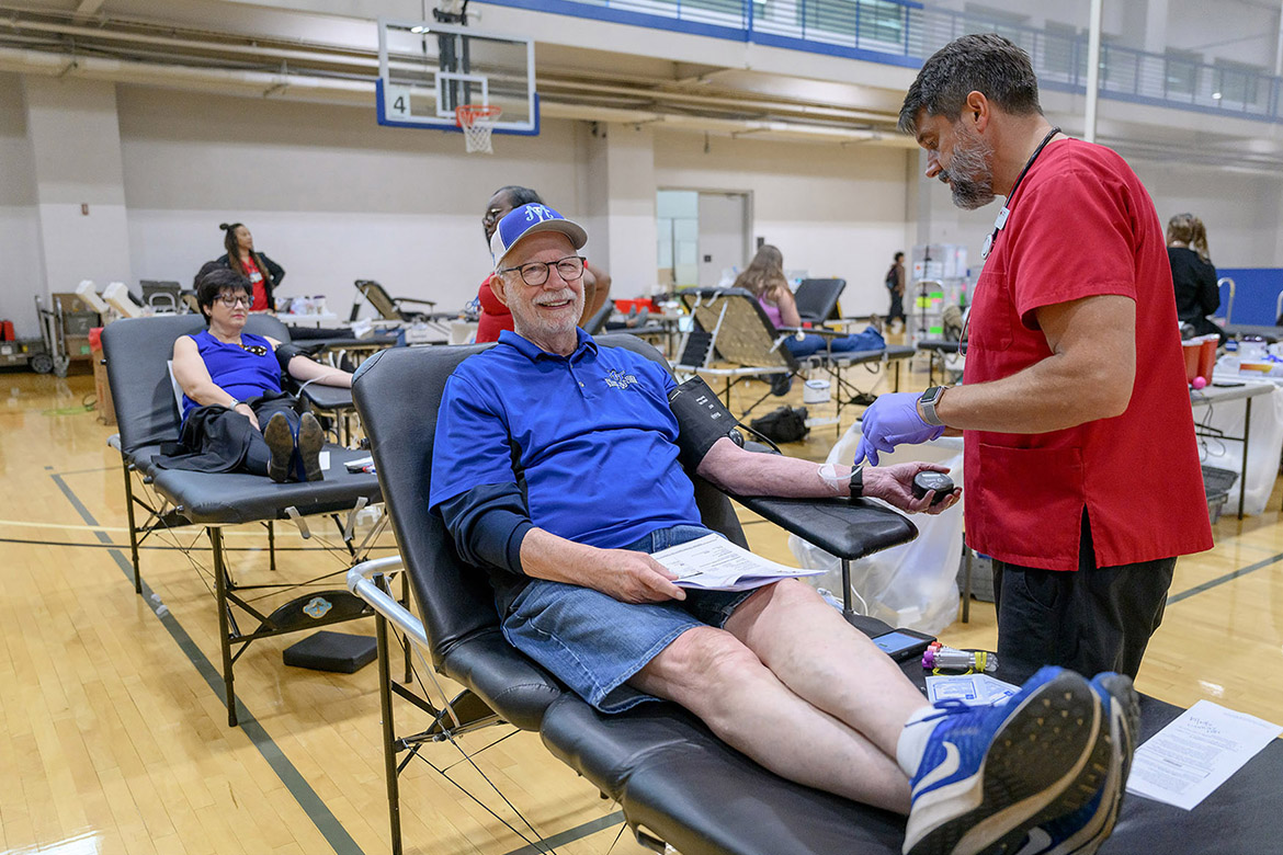 Dick Palmer, a play-by-play broadcaster for Middle Tennessee State University Athletics, rolls his sleeves up at the 2024 “Bleed Blue to Beat WKU” blood drive. This year’s event is set for noon to 6 p.m. Monday-Wednesday, Oct. 27-29, at Campus Recreation Center, 1848 Blue Raider Drive on campus in Murfreesboro, Tenn. (MTSU file photo by J. Intintoli)