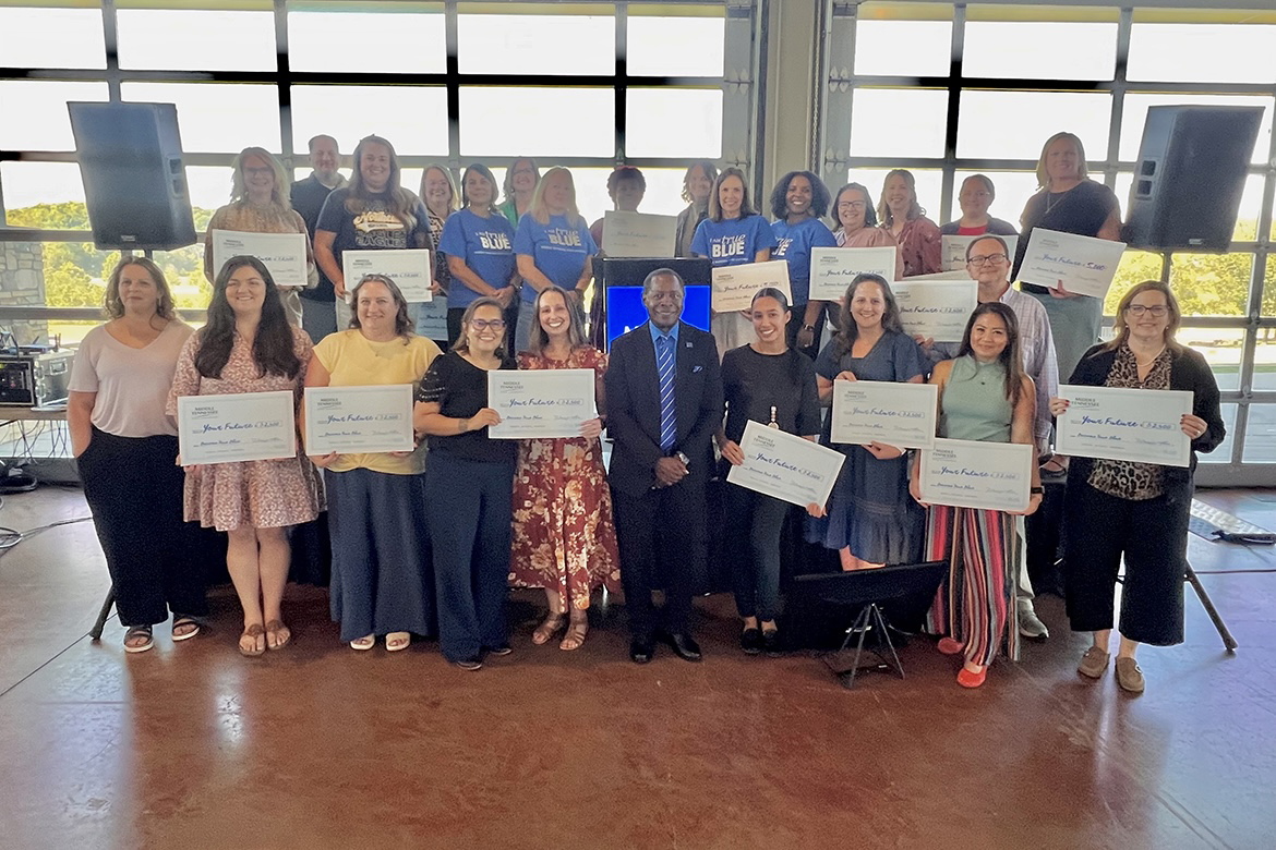 Middle Tennessee State University President Sidney A. McPhee, first row in center, is pictured with Clarksville-area high school counselors who received scholarships to award to their students Thursday, Oct. 2, during the MTSU True Blue Tour stop in Clarksville, Tenn., at the Wilma Rudolph Event Center. (MTSU photo by Andrew Oppmann)