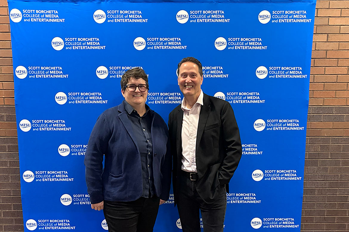 Mitch Glazier, chairman and CEO of the Recording Industry Association of America, and Michelle Conceison, chair of the Department of Recording Industry at Middle Tennessee State University in Murfreesboro, Tenn., pose for a photo inside the Scott Borchetta College of Media and Entertainment on Tuesday, Oct. 7, 2025. Glazier visited campus for a presentation to students about how artificial intelligence is reshaping the music industry.  (MTSU photo by Stacey Tadlock)