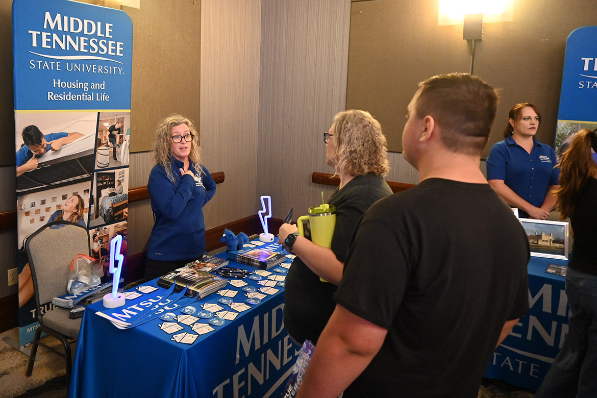 Amy Korstange, left, associate director for Housing and Residential Life at Middle Tennessee State University in Murfreesboro, Tenn., shares information with prospective students and parents attending the university’s True Blue Tour recruitment stop Sept. 25 at The Chattanoogan Hotel in Chattanooga, Tenn. (MTSU photo by Jimmy Hart)