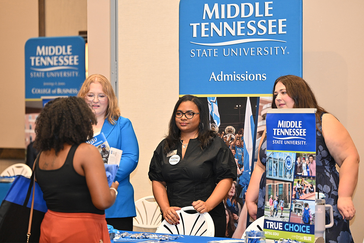 Middle Tennessee State University Admissions staff, from left, Kerrington Dougherty, Jay Wilson and Allison Lovett talk with a potential Blue Raider during the university’s True Blue Tour student recruitment stop held Tuesday, Sept. 23, at the Farm Bureau Exposition Center. in Lebanon, Tenn. (MTSU photo by James Cessna)
