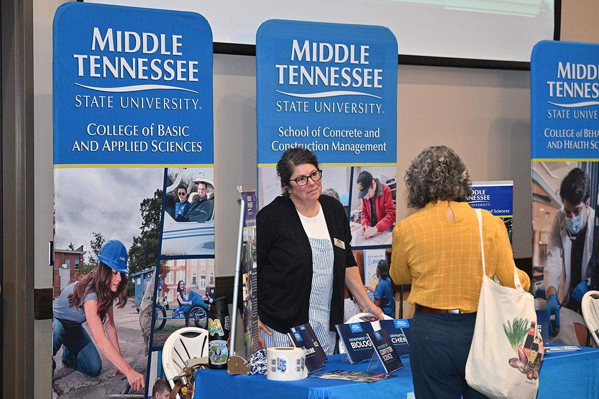 Middle Tennessee State University College of Basic and Applied Sciences advisor Jennifer Danylo talks with Wilson Central High School counselor Lauren Fung during the university’s True Blue Tour luncheon held Tuesday, Sept. 23, at the Farm Bureau Exposition Center in Lebanon, Tenn. A total of $25,000 in scholarships was given to school counselors who will distribute them among students planning to attend MTSU. (MTSU photo by James Cessna)