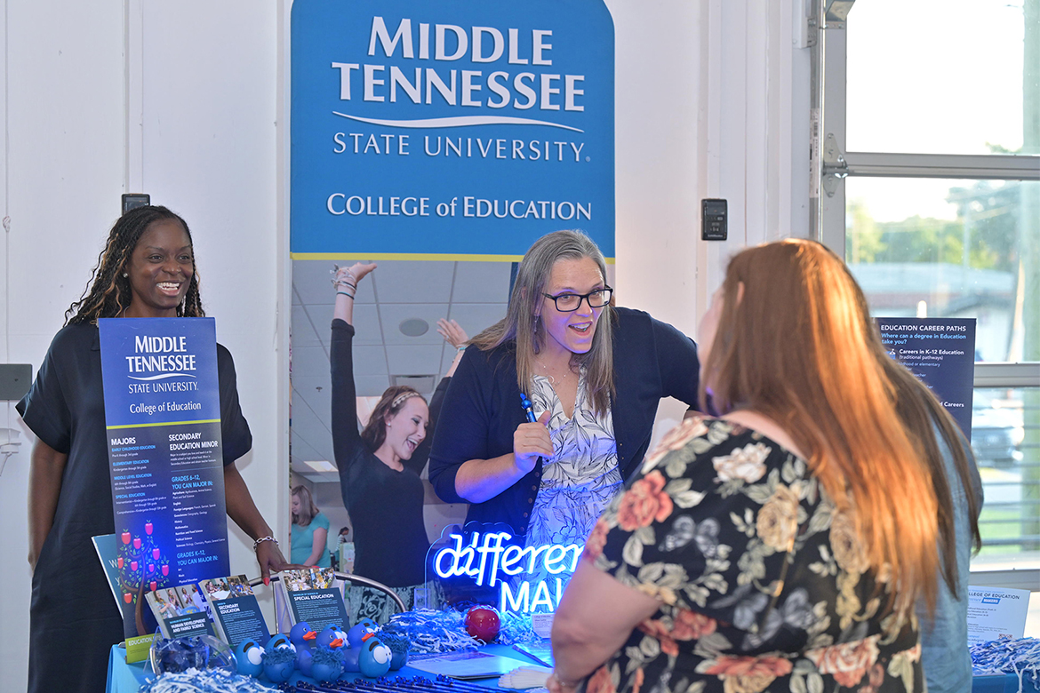 Middle Tennessee State University College of Education Dean Neporcha Cone, left, and Advising Director Tiffany Fantine, center, talk with a prospective student and her parent during the recent True Blue Tour student recruitment reception held at 14TENN event center in Nashville on Monday, Sept. 29. (MTSU photo by James Cessna)