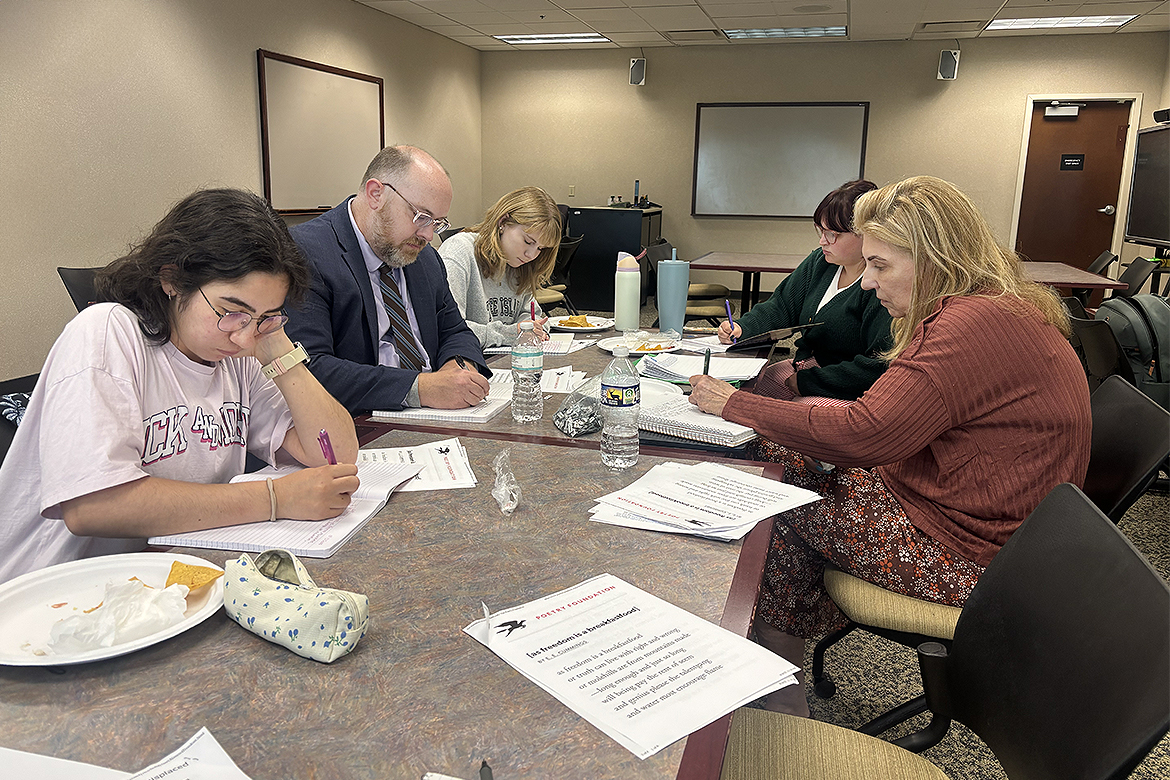 Participating in a 10-minute free-writing session as part of the “Tacos and Trauma” workshop at Middle Tennessee State University in Murfreesboro, Tenn., are, clockwise from left, student Gamze Mert, University Writing Center Director James Hamby, and students Autumn McCleskey, Chelsea Barranger and group founder Hillorie McLarty. The group meets at 1 p.m. each Friday through Nov. 20 in Room 387 of James E. Walker Library. (MTSU photo by Nancy DeGennaro)