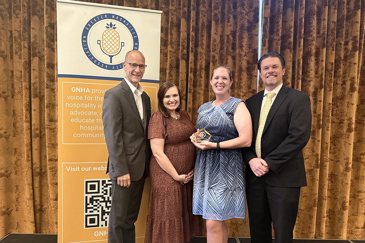 Elizabeth Whalen, director of the Tourism and Hospitality Management, or THM, program at Middle Tennessee State University in Murfreesboro, Tenn., was presented the Industry Educator of the Year Award from the Greater Nashville Tourism Association at the annual meeting and banquet in July. Pictured are, from left, Michael Sanders, vice president of hotel operations for Chartwell Hospitality; Chelsa Lourie, director of workforce development with the Tennessee Hospitality Tourism Association; Whalen, holding her award; and Jesse Hayes, director of revenue management at Gaylord Opryland. All are members of MTSU’s THM Advisory Board. (Submitted photo)