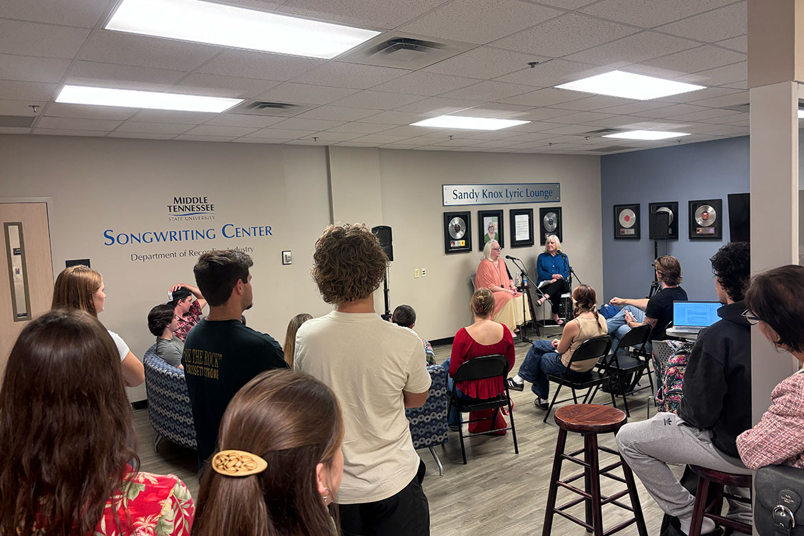 Grammy-nominated songwriter Sandy Knox, back left at mic, participates in a Q&A session Tuesday, Sept. 30, 2025, in her namesake Sandy Knox Lyric Lounge in the Middle Tennessee State University Recording Industry Department’s Songwriting Center inside the Miller Education Center on campus in Murfreesboro, Tenn. Beverly Keel, back right, dean of the Scott Borchetta College of Media and Entertainment, led the session. (MTSU photo by Stacey Tadlock)