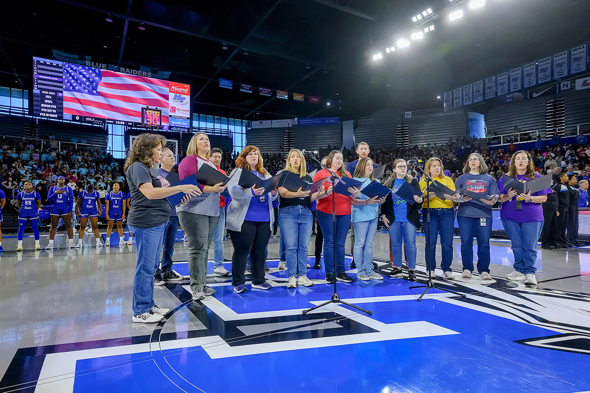 As part of the annual Education Day, Murfreesboro City Schools music teachers from across the district sang the national anthem before tipoff of the Middle Tennessee State University Lady Raiders game held Monday, Nov. 3, in Murphy Center on campus in Murfreesboro, Tenn. More than 4,500 fourth- through sixth-grade students from 14 city schools attended the annual event. (MTSU photo by Andy Heidt)