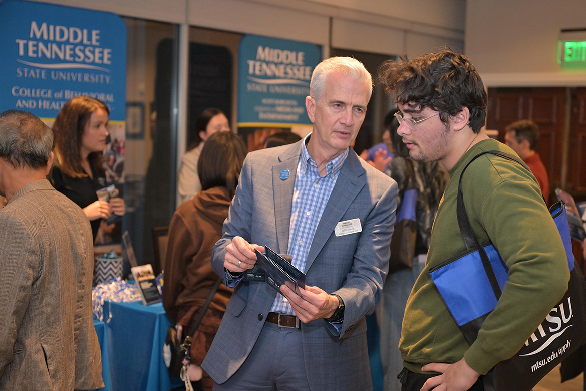 Jeff Gibson, left, associate dean in the College of Liberal Arts at Middle Tennessee State University in Murfreesboro, Tenn., talks with a potential Blue Raider at the True Blue Tour student recruitment stop held Tuesday, Oct. 28, at Gaylord Springs Golf Links in Nashville, Tenn. (MTSU photo by James Cessna)