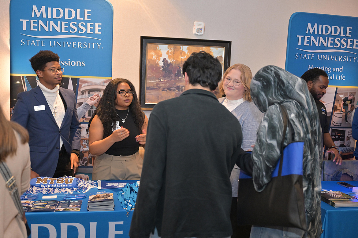 Talking to potential Blue Raiders at the True Blue Tour student recruitment stop held Tuesday, Oct. 28, at Gaylord Springs Golf Links in Nashville, Tenn., are admissions team members, from left, Kindred Locke, Alexandria Hamilton and Kerrington Dougherty. (MTSU photo by James Cessna)