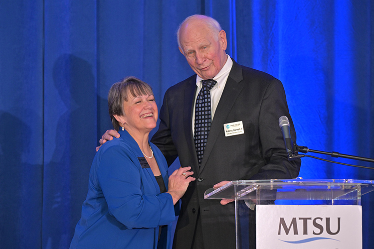 Joyce Heames, left, dean of the Jennings A. Jones College of Business at Middle Tennessee State University in Murfreesboro, Tenn., shares a laugh with Aubrey Harwell Jr., holder of the college’s Chair of Excellence in Free Enterprise, during the college’s 2025 Leadership Awards ceremony held Oct. 14 at Stones River Country Club in Murfreesboro, Tenn. (MTSU photo by James Cessna)