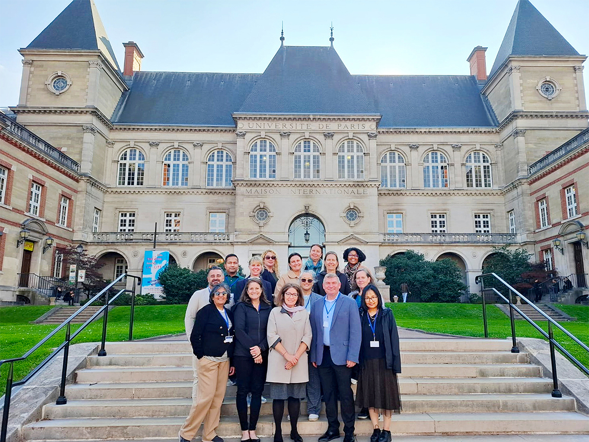 Leah Tolbert Lyons, dean of the College of Liberal Arts at Middle Tennessee State University in Murfreesboro, Tenn., top right, stands with fellow U.S. participants in the Fulbright International Education Administrators Program at the Cité Internationale Universitaire de Paris on Oct. 14, 2025. The residential campus houses graduate students and scholars from around the world, with buildings representing international partnerships, including the U.S. pavilion built in the 1920s. Lyons was one of 14 higher education professionals selected to take part in the Fulbright France program focused on strengthening global academic collaboration. (Submitted photo)