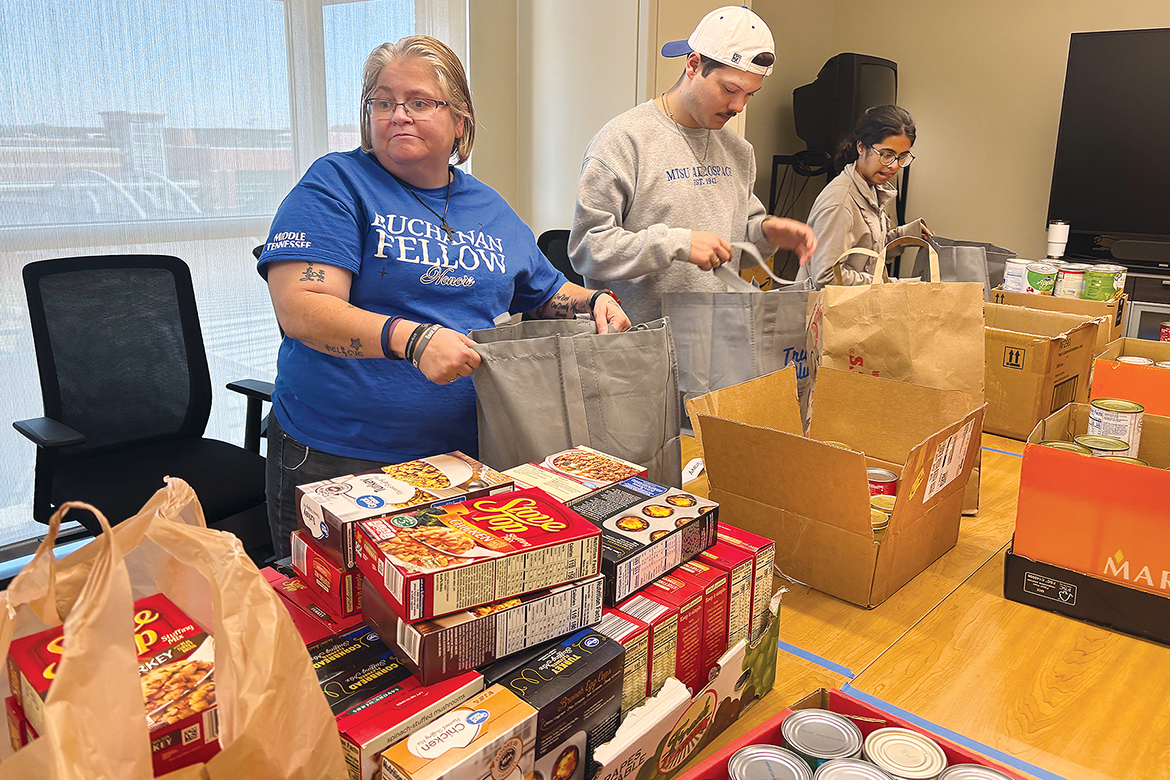 Students from the University Honors College Research Seminar class at Middle Tennessee State University in Murfreesboro, Tenn., assemble nonperishable items for Thanksgiving meal bags for students in need inside the Student Union on Wednesday, Nov. 5, in the Center for Student Involvement and Leadership at the Student Union Building on campus. (MTSU photo by Nancy DeGennaro)