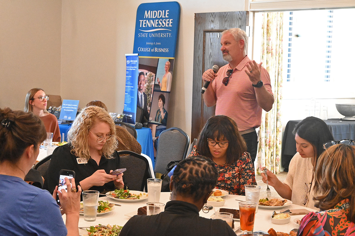 Middle Tennessee State University alumnus Ryan Porter, chief operating officer of Jackson Energy Authority in Jackson, Tenn., shares about his positive experiences at MTSU’s Murfreesboro campus with counselors attending the university’s high school guidance counselors and community college luncheon as part of the university’s True Blue Tour stop on Nov. 5 at the Jackson Country Club in Jackson, Tenn. (MTSU photo by Jimmy Hart)
