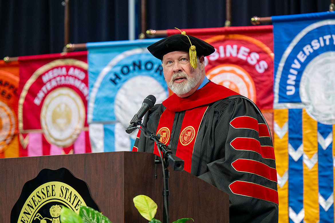 Middle Tennessee State University Class of ’91 alumnus Chris Whaley, president of Roane State Community College in Harriman, Tenn., encourages graduates to “find your people” in his keynote address to fall 2025 graduates during the morning commencement ceremony held Saturday, Dec. 13, inside Murphy Center on campus in Murfreesboro, Tenn. (MTSU photo by Cat Curtis Murphy)
