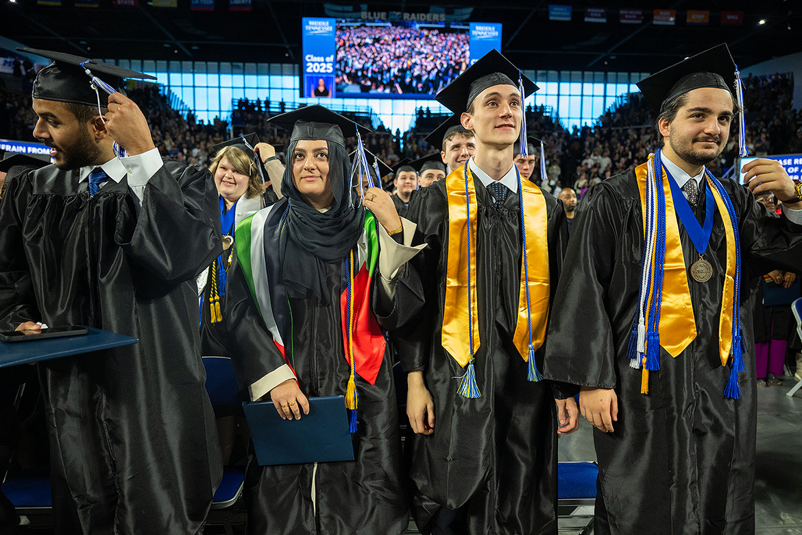 Proud Middle Tennessee State University graduates move their tassels from the right to the left in recognition of their achievement to conclude the fall 2025 morning commencement ceremony held Saturday, Dec. 13, in Murphy Center on the MTSU campus in Murfreesboro, Tenn. (MTSU photo by Cat Curtis Murphy)