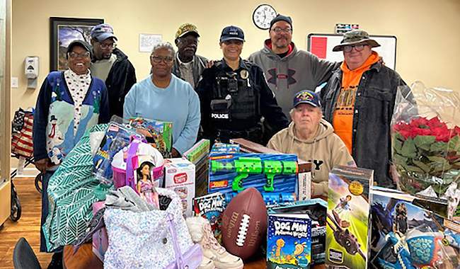 Middle Tennessee State University Police Sgt. Vergena Forbes, center, is pictured with members of a military veteran’s group who dropped off toys that have since been distributed as part of this year’s Little Raiders Gift-Giving Campaign. The group chose to be Secret Santas for two children supported by this year’s campaign. (Submitted photo)