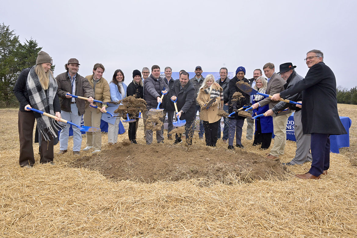 Middle Tennessee State University Aerospace Department students and faculty, along with MTSU administrators, perform the ceremonial shoveling of dirt during the groundbreaking ceremony held Wednesday, Dec. 3, for the new $73.4 million MTSU Aerospace facility that will be built at the Shelbyville Municipal Airport in Shelbyville, Tenn., are members of the (MTSU photo by Andy Heidt)