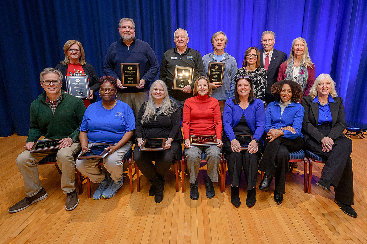 Middle Tennessee State University employees with 30 years of service display their awards for a group photo during the annual Service Awards Luncheon held in early December in the James Union Building Ballroom on campus in Murfreesboro, Tenn. Pictured, front row from left, are Scott McDaniel, Yvette Batts, Karen Wolfe, Carla Hatfield, Wendy Brown, Mimi Thomas, and Beverly Keel. Back row, from left, are Gina Poole, Ray Wiley, Rick Kurtz, Bill Stewart, Michelle Boyer-Pennington, Pat Geho, and Kim Sadler. (MTSU photos by Andy Heidt)