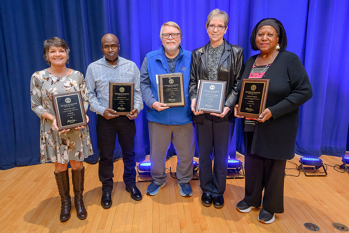 Middle Tennessee State University employees with 40 years of service display their awards for a group photo during the annual Service Awards Luncheon held in early December in the James Union Building Ballroom on campus in Murfreesboro, Tenn. Pictured, from left, are Vivian Alley, Donnie Murray, Carroll Van West, Gayle Barker, and Linda Jordan. (MTSU photos by Andy Heidt)