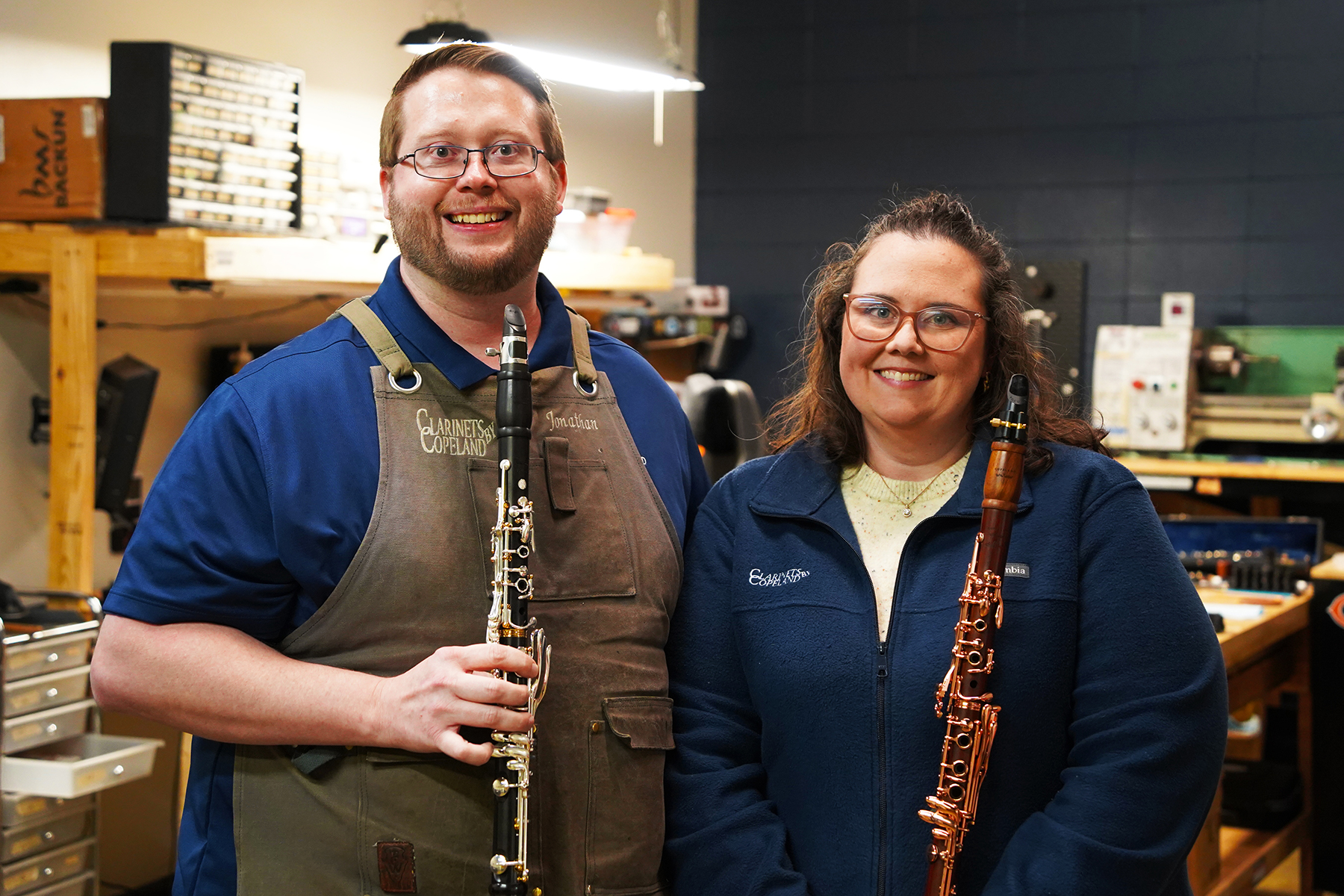 Jonathan and Ashley Copeland, owners of Clarinets by Copeland and alumni of Middle Tennessee State University in Murfreesboro, Tenn., pose for a portrait in their repair shop in Shelbyville, Ky., while holding clarinets from their own product line on Jan. 12, 2026. The instruments reflect skills and discipline developed during their time at MTSU and refined through years of repair and refurbishment work. (MTSU photo by Mike Davis)