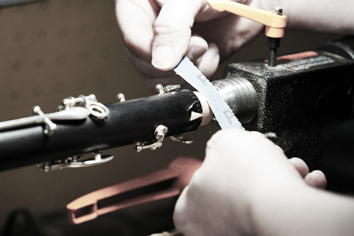 Jonathan Copeland sands a clarinet component while completing repair work for a customer at his workshop in Shelbyville, Ky., on Jan. 12, 2026. Copeland and his wife, Ashley — both alumni of Middle Tennessee State University in Murfreesboro, Tenn. — built the business from a small repair operation into an internationally known shop that restores and produces professional clarinets. (MTSU photo by Mike Davis)