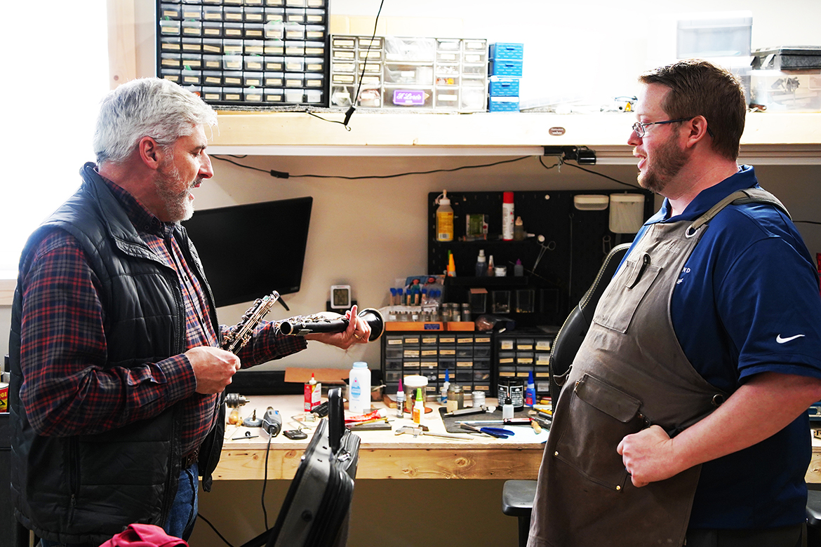 Jonathan Copeland, right, owner of Clarinets by Copeland and an alumnus of Middle Tennessee State University in Murfreesboro, Tenn., speaks with Todd Waldecker, an MTSU professor of clarinet and Copeland’s former instructor, about repairs needed on Waldecker’s instrument, in the Clarinets by Copeland workshop in Shelbyville, Ky., on Jan. 12, 2026. The interaction reflects the lasting mentorship connections formed during Copeland’s education at MTSU. (MTSU photo by Mike Davis)