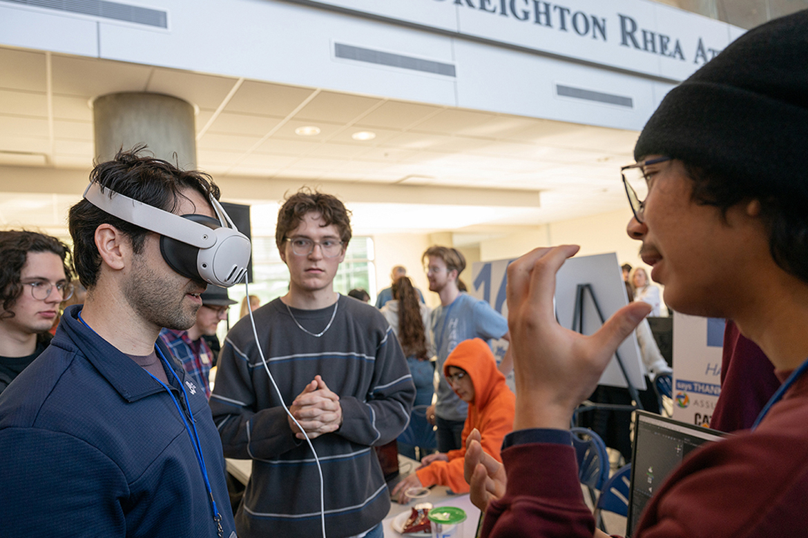 Middle Tennessee State University computer science major Hernan Hernandez, right, talks with a tester as teammate Aiden J. Martin, center, listens to the explanation of their project at the 11th annual Middle Tennessee State University Computer Science Department HackMT competition held on campus Friday, Jan. 30, through Sunday, Feb. 1, in Murfreesboro, Tenn. This year’s 36-hour hackathon was the largest yet, with 21 teams, 153 student participants and nearly two dozen alumni mentors. (MTSU photo by Cat Curtis Murphy)