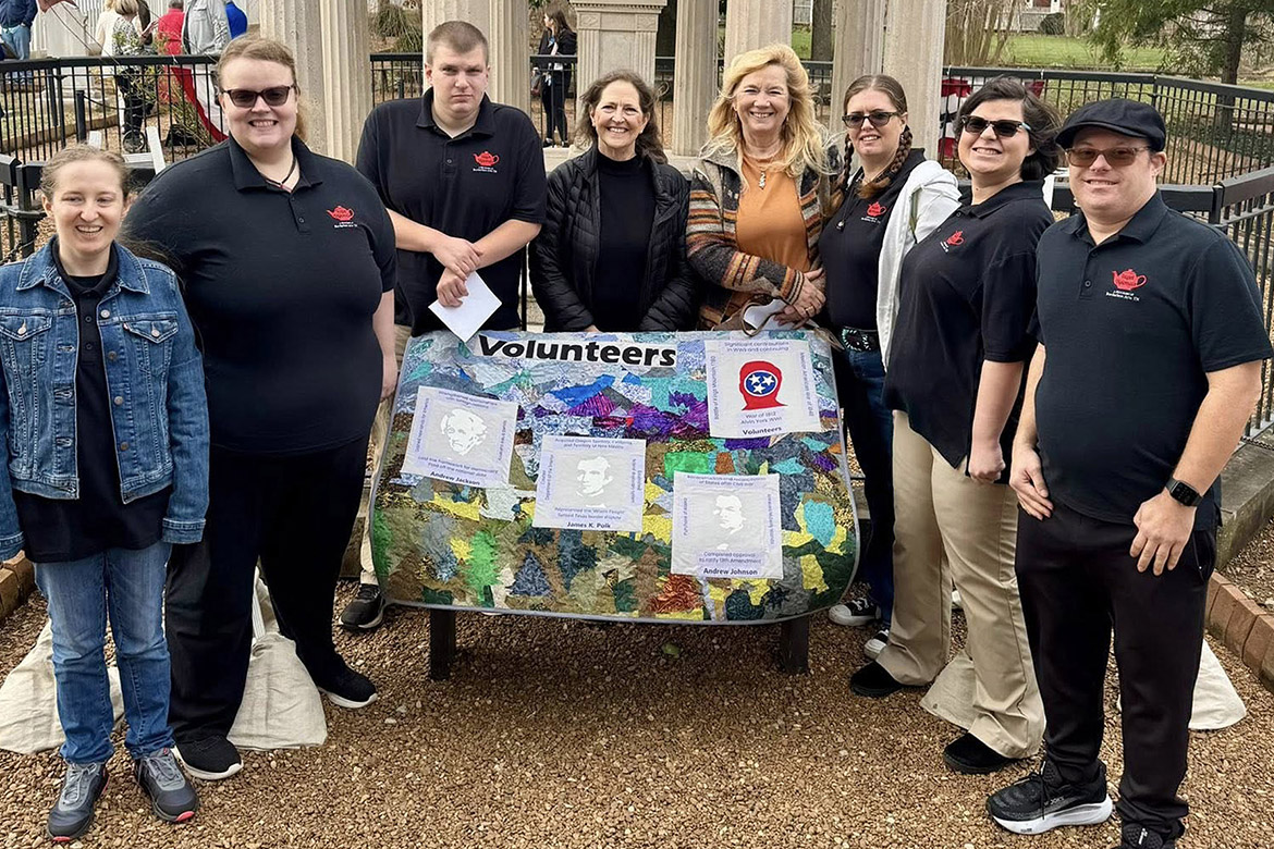 Through a partnership with Middle Tennessee State University in Murfreesboro, Tenn., Borderless Arts Tennessee members gather on Jan. 8, 2026, at The Hermitage in Hermitage, Tenn. — historic home of late United States President Andrew Jackson — to present an art project during the commemoration of the Battle of New Orleans, which was led by Gen. Jackson and helped earn Tennessee the “Volunteer State” moniker. Standing with their quilted artwork are Borderless Arts members, from left, Jennifer Scallorn, Hope McKee, Jon Pfeiffer, MTSU professor Lauren Rudd, MTSU master instructor Lori Kissinger, Erica McMurray, Torie Summers and Adam Boyd. (Submitted photo)