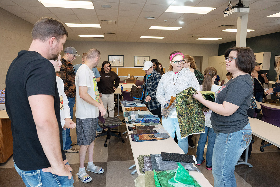 Borderless Arts Tennessee members team up with students and staff at Middle Tennessee State University in Murfreesboro, Tenn., for a project that will be part of the state’s celebration of the United States’ 250th anniversary. Working on the project are, clockwise from left, MTSU students Michael Forrest and Lauren Simpkins; BAT member Clinton Fyke; MTSU student Cody Ried; BAT member Jon Pfeiffer; and MTSU students Marian Abdelmasih and Noelle Jamison; BAT members Adam Boyd, Hope McKee and Erica McMurray; and Torie Summers. (MTSU photo by James Cessna)