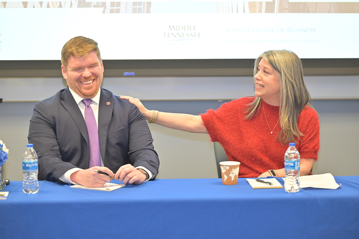 Ryan Egly, left, president and CEO of the Lawrence County Chamber of Commerce, and Lori Odom, senior vice president of economic development with the Nashville Area Chamber of Commerce, share a lighthearted moment during an economic development panel held Jan. 23 in the Business and Aerospace Building at Middle Tennessee State University in Murfreesboro, Tenn. The panel was co-hosted by the chamber and MTSU’s Jennings and Rebecca Jones Chair of Excellence in Regional and Urban Planning. (MTSU photo by James Cessna)